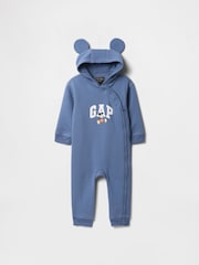 Mochila escolar azul - Pijama tipo pelele con capucha, diseño de Disney y logo para bebé de Gap (recién nacido - 12 meses) - Imagen 1 de 3