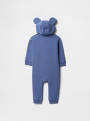 Mochila escolar azul - Pijama tipo pelele con capucha, diseño de Disney y logo para bebé de Gap (recién nacido - 12 meses) - Imagen 2 de 3