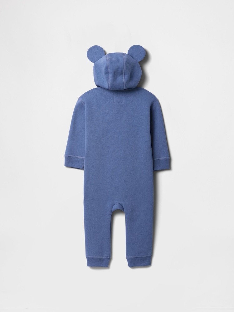 Mochila escolar azul - Pijama tipo pelele con capucha, diseño de Disney y logo para bebé de Gap (recién nacido - 12 meses) - Imagen 2 de 3