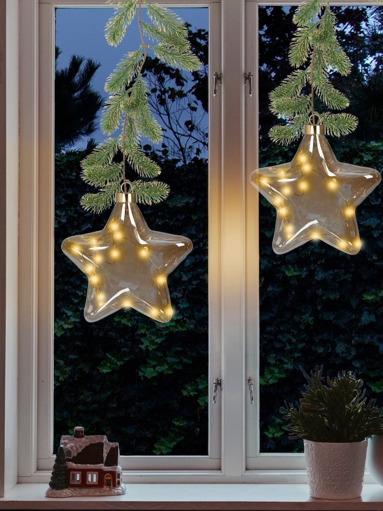 Lumineo Clear Pre Lit LED Hanging Christmas Star Bauble - Image 1 of 3 Lumineo Clear Pre Lit LED Hanging Christmas Star Bauble - Image 1 of 3