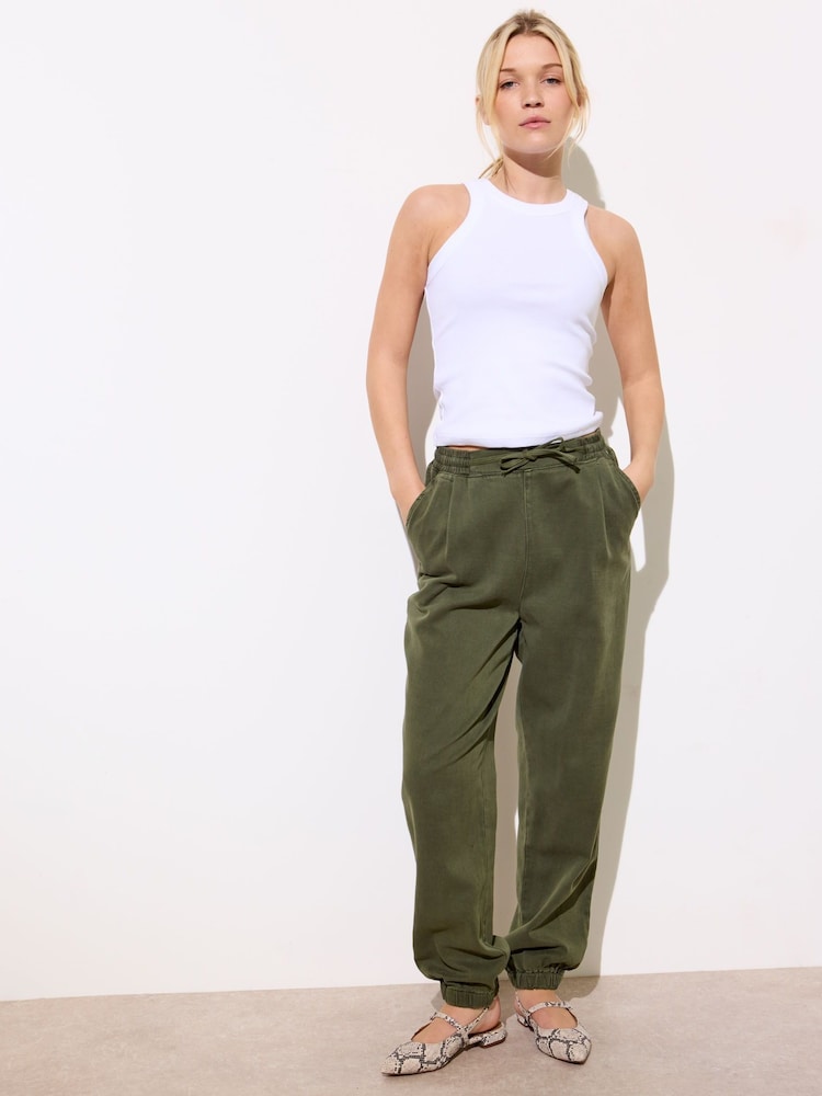 Oliver Bonas Green Denim Jogging Trousers - Image 1 of 7 Oliver Bonas Green Denim Jogging Trousers - Image 1 of 7
