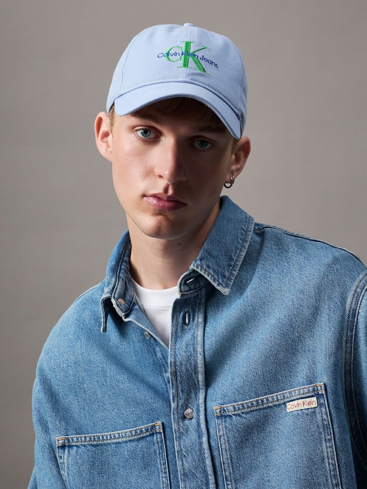 Calvin Klein Blue Mono Logo Embro 100% Cotton Cap - Image 1 of 5 Calvin Klein Blue Mono Logo Embro 100% Cotton Cap - Image 1 of 5