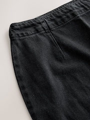 שחור - חצאית מיני בגזרת שעון חול מבד ג'ינס - תמונה 7 מתוך 7