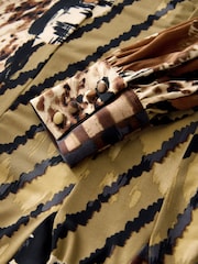Estampa animal brown emendada - Vestido mini de manga comprida evasê - Imagem 2 de 3