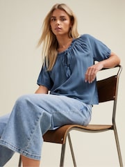M&Co Blue Petite Acid Wash Boho Top - Image 1 of 6