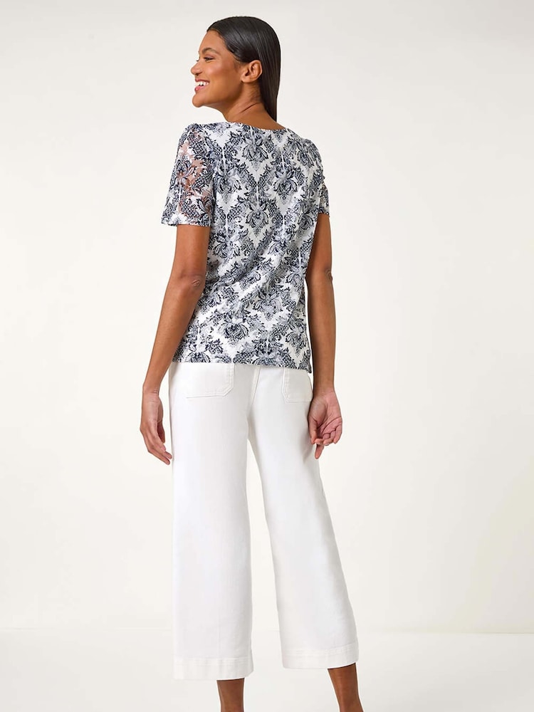 Top de encaje elástico con estampado de Roman - Imagen 2 de 5