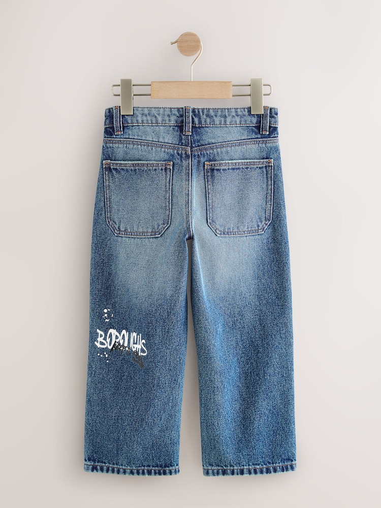 Varsity All Over Print Mid Blue Denim Wide Fit Authentic Jeans (3-16yrs) - Image 2 of 4 Varsity All Over Print Mid Blue Denim Wide Fit Authentic Jeans (3-16yrs) - Image 2 of 4