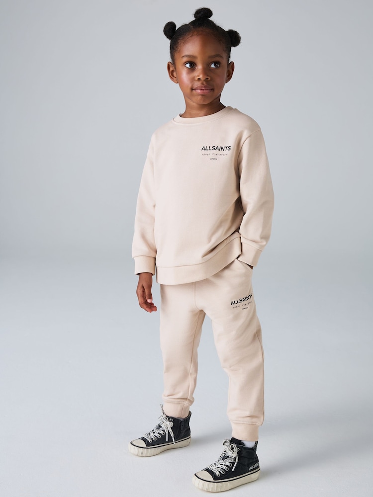 smALLSAINTS Mid Pink Underground Oversized Younger Girls Sweatshirt and Joggers Set - Image 1 of 13 smALLSAINTS Mid Pink Underground Oversized Younger Girls Sweatshirt and Joggers Set - Image 1 of 13