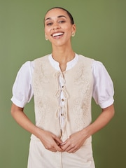 Yumi Cream 100% Cotton Knitted Tie Front Waistcoat With Floral Details - Image 1 of 5