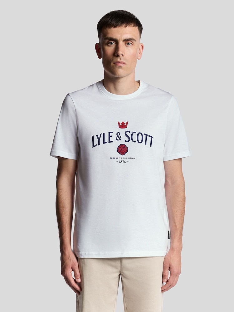 Lyle & Scott White Cheers To Tradition Graphic Print T-Shirt - Image 1 of 3 Lyle & Scott White Cheers To Tradition Graphic Print T-Shirt - Image 1 of 3