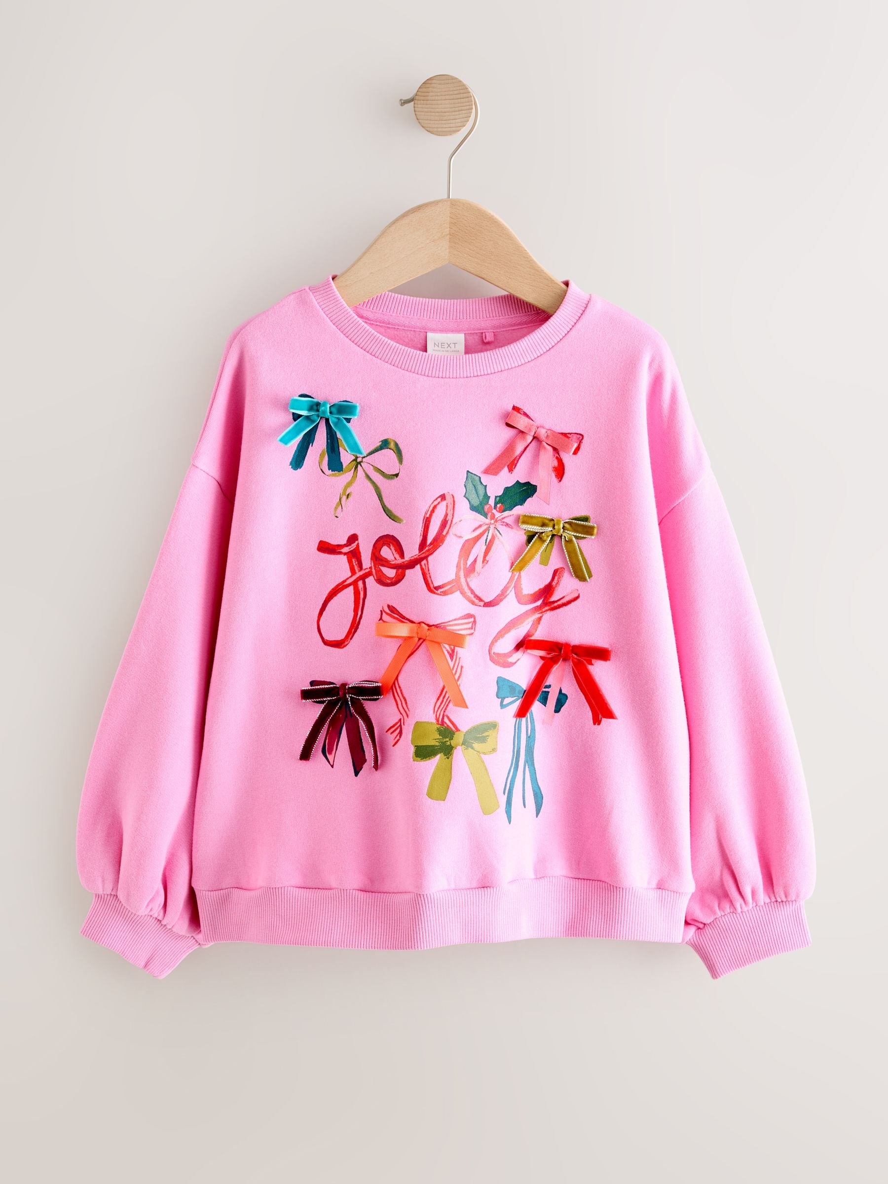 Buy Pink Bow Jolly Christmas Jumper Sweatshirt (3-16yrs) from Next USA