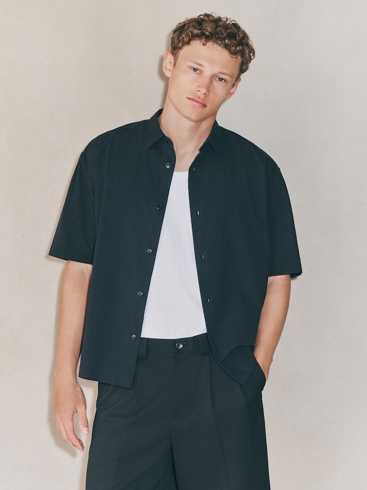 Buy Black EDIT Boxy Fit Seersucker Short Sleeve Shirt from Next USA Buy Black EDIT Boxy Fit Seersucker Short Sleeve Shirt from Next USA