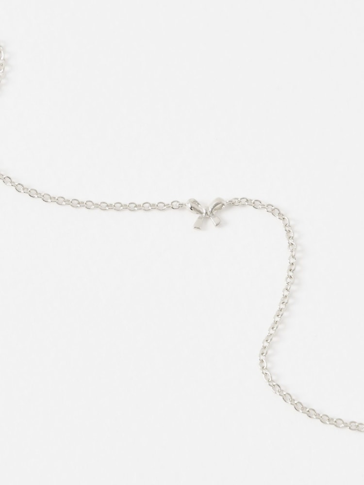 Oliver Bonas Silver Tone Paloma Sterling Mini Bow Bracelet - Image 2 of 3
