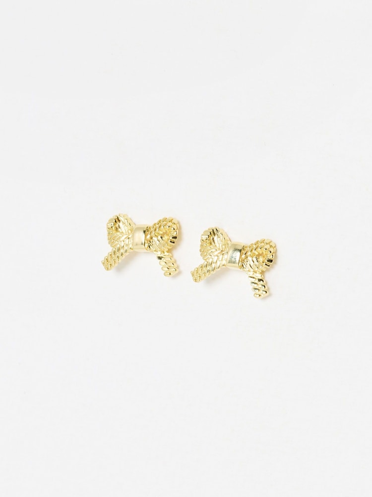 Oliver Bonas Gold Tone Bria Rope Texture Bow Stud Earrings - Image 1 of 5 Oliver Bonas Gold Tone Bria Rope Texture Bow Stud Earrings - Image 1 of 5