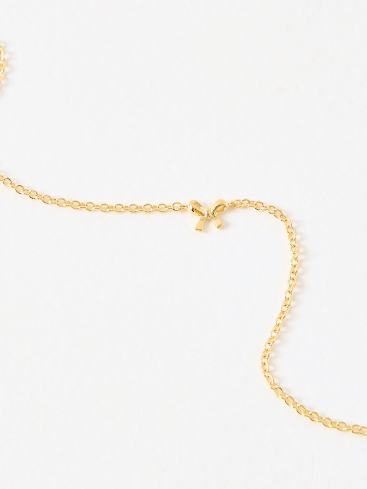 Oliver Bonas Gold Tone Paloma Mini Bow Bracelet - Image 2 of 3