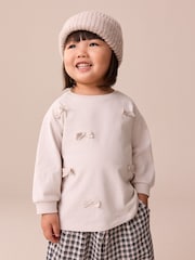 Cream Bow Applique Long Sleeve Bow Appliqué Top (3mths-7yrs) - Image 1 of 10