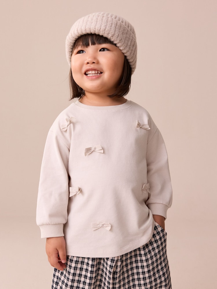 Cream Bow Applique Long Sleeve Bow Appliqué Top (3mths-7yrs) - Image 1 of 10