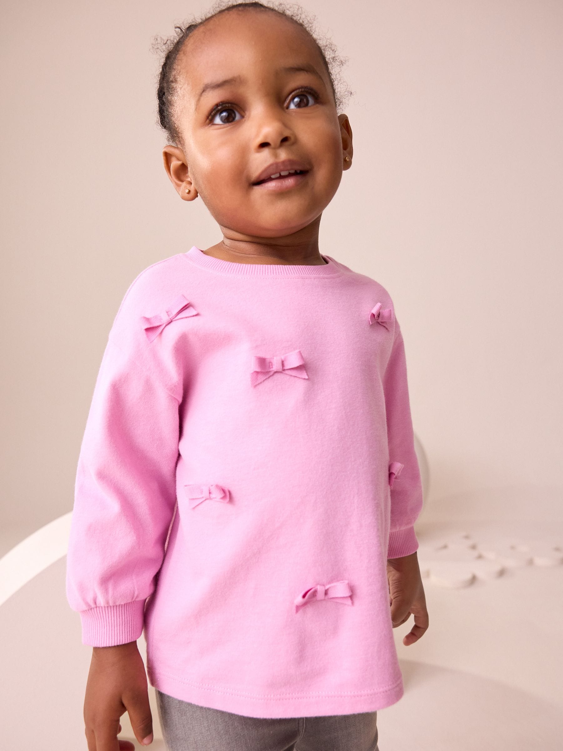 Buy Pink Long Sleeve Bow Appliqué Top (3mths-7yrs) from the Next