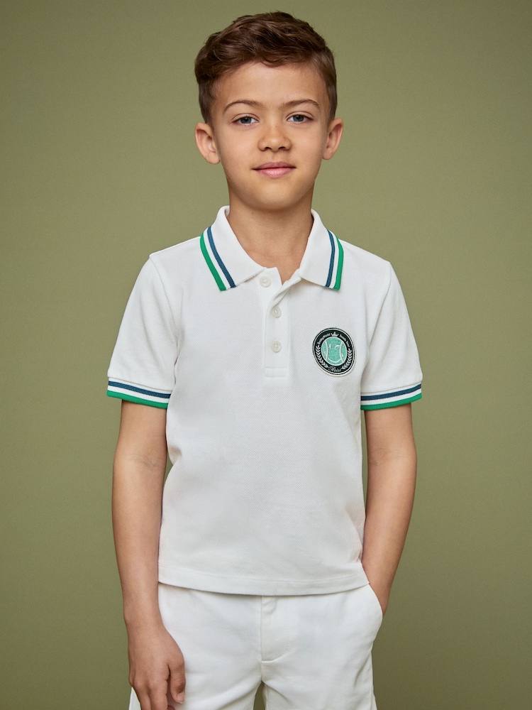 Reiss White 3-9 yrs SmileyWorld | Reiss Piqué Polo Shirt - Image 1 of 4