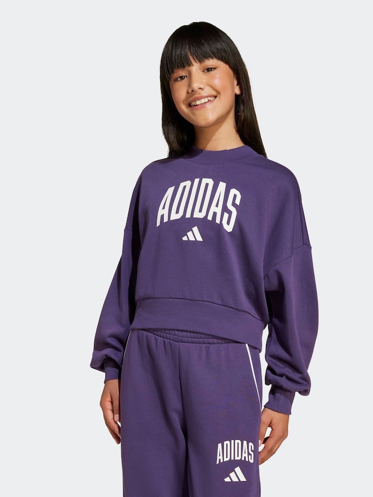 adidas Purple Essentials Collegiate Kids Sweatshirt - Image 1 of 6 adidas Purple Essentials Collegiate Kids Sweatshirt - Image 1 of 6