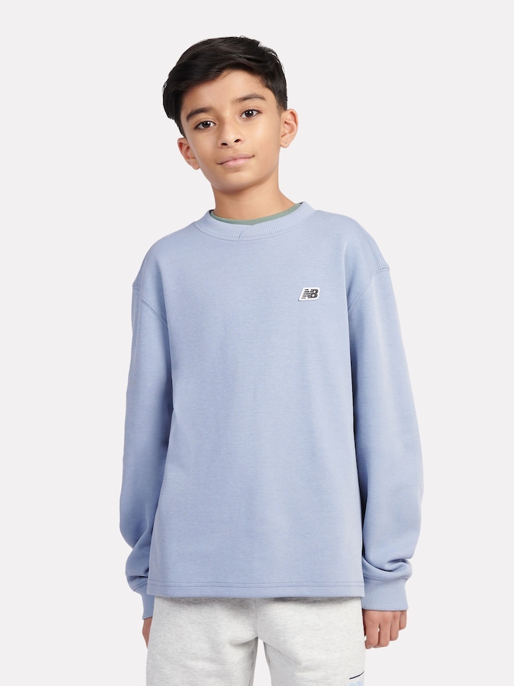 New Balance Blue Kids Premium Cross Neck T-Shirt - Image 1 of 6 New Balance Blue Kids Premium Cross Neck T-Shirt - Image 1 of 6