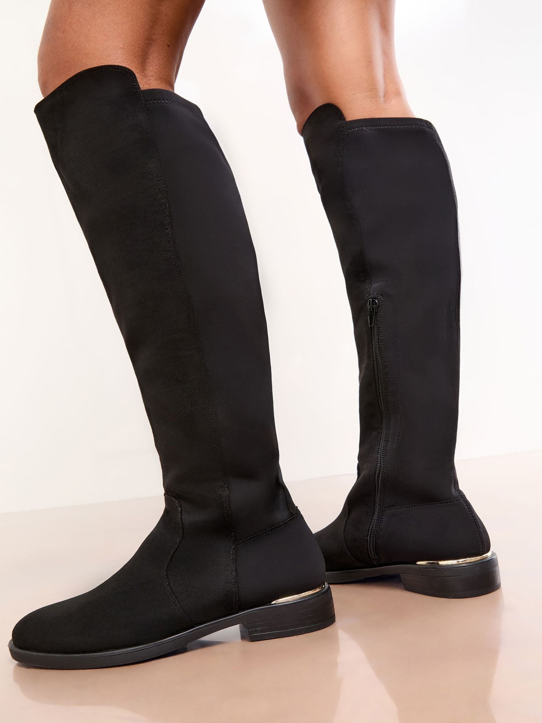 Buy Lipsy Black Wide Fit Faux Suede Elasticated Flat Knee High
