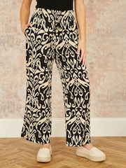 Yumi Black Relaxed Fit Ikat Print Trousers - Image 1 of 3