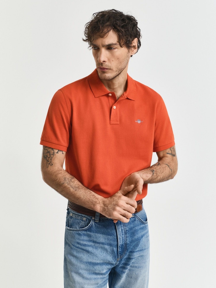 GANT Orange Regular Fit 100% Cotton Shield Piqué Polo Shirt - Image 1 of 4 GANT Orange Regular Fit 100% Cotton Shield Piqué Polo Shirt - Image 1 of 4