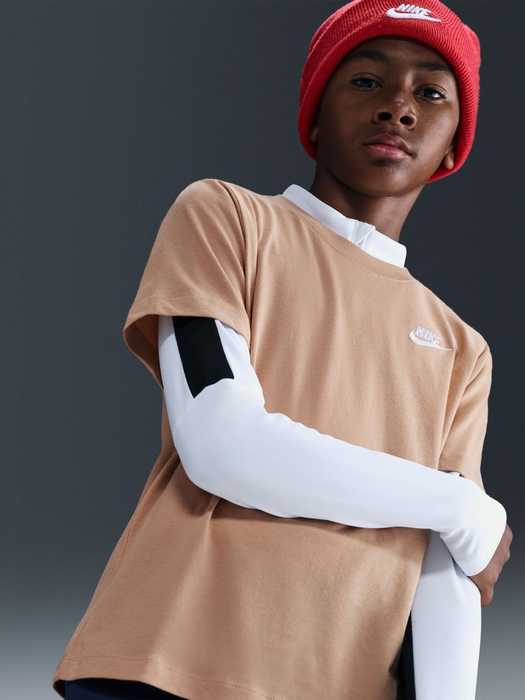 white and brown nike shirt