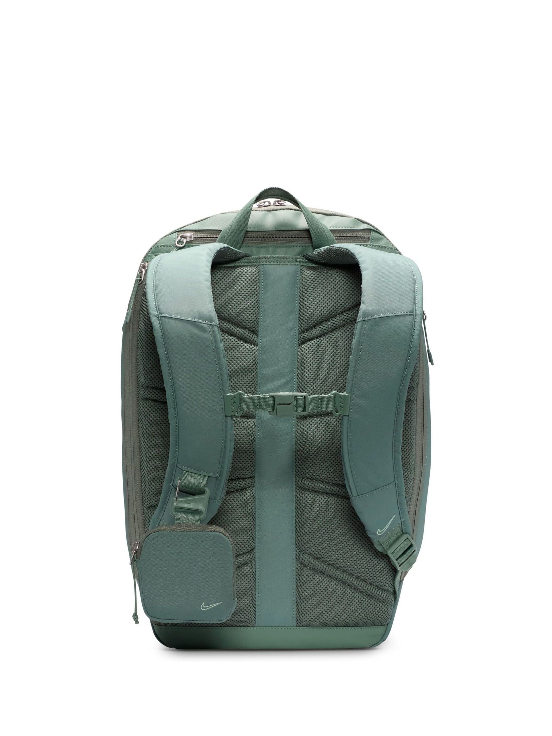 grey and green nike backpack