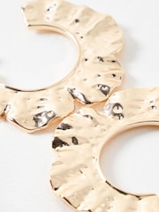 Oliver Bonas Gold Tone Hera Hammered Floral Print Curve Large Hoops Earrings - Image 2 of 5