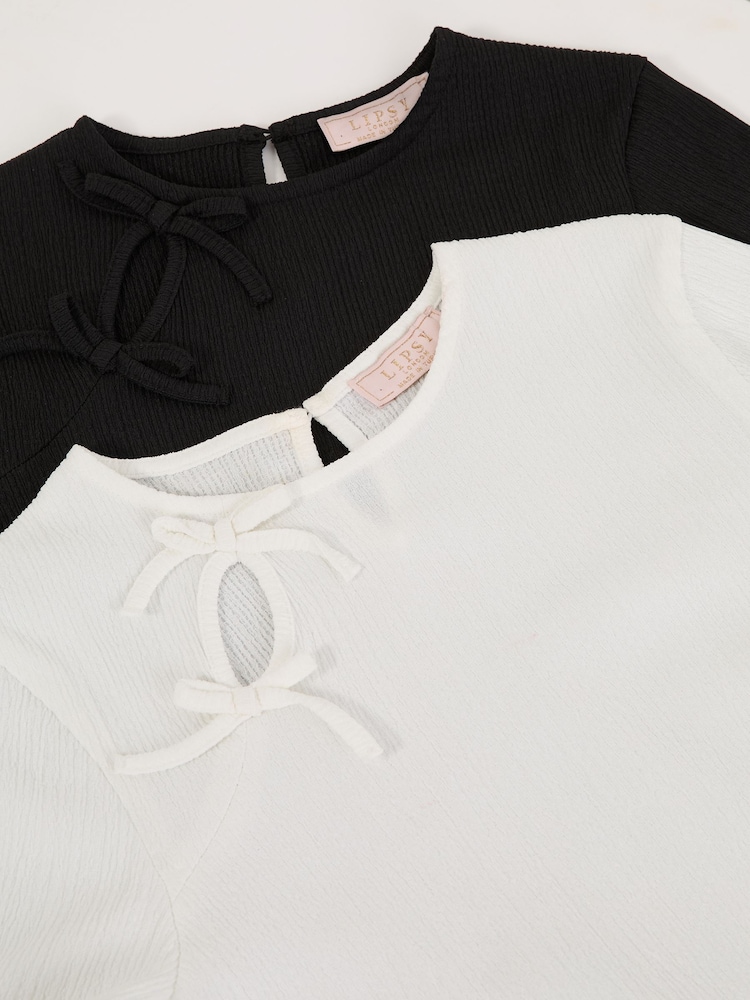 Lipsy 2 Pack Bow Eyelet Detail Tops (5-16yrs) - Imagen 2 de 7