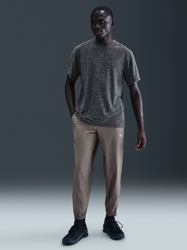 Nike Grey Stone Dri-FIT Form Tapered Training Joggers - Image 1 of 5 Nike Grey Stone Dri-FIT Form Tapered Training Joggers - Image 1 of 5