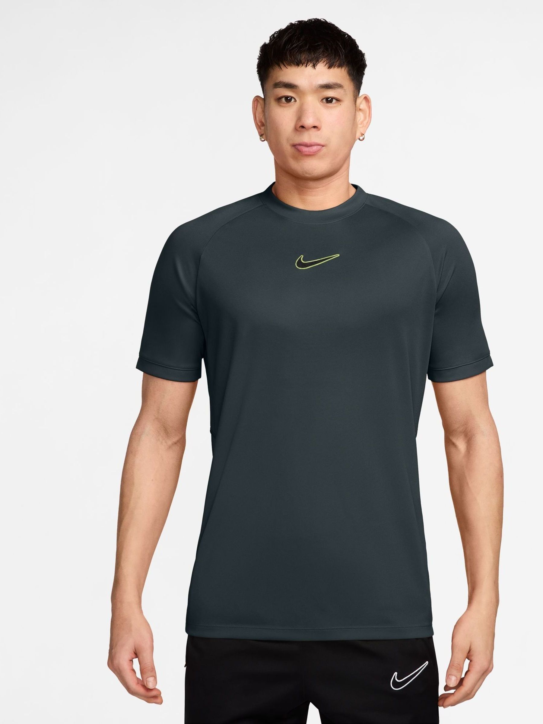 green strike nike shirt