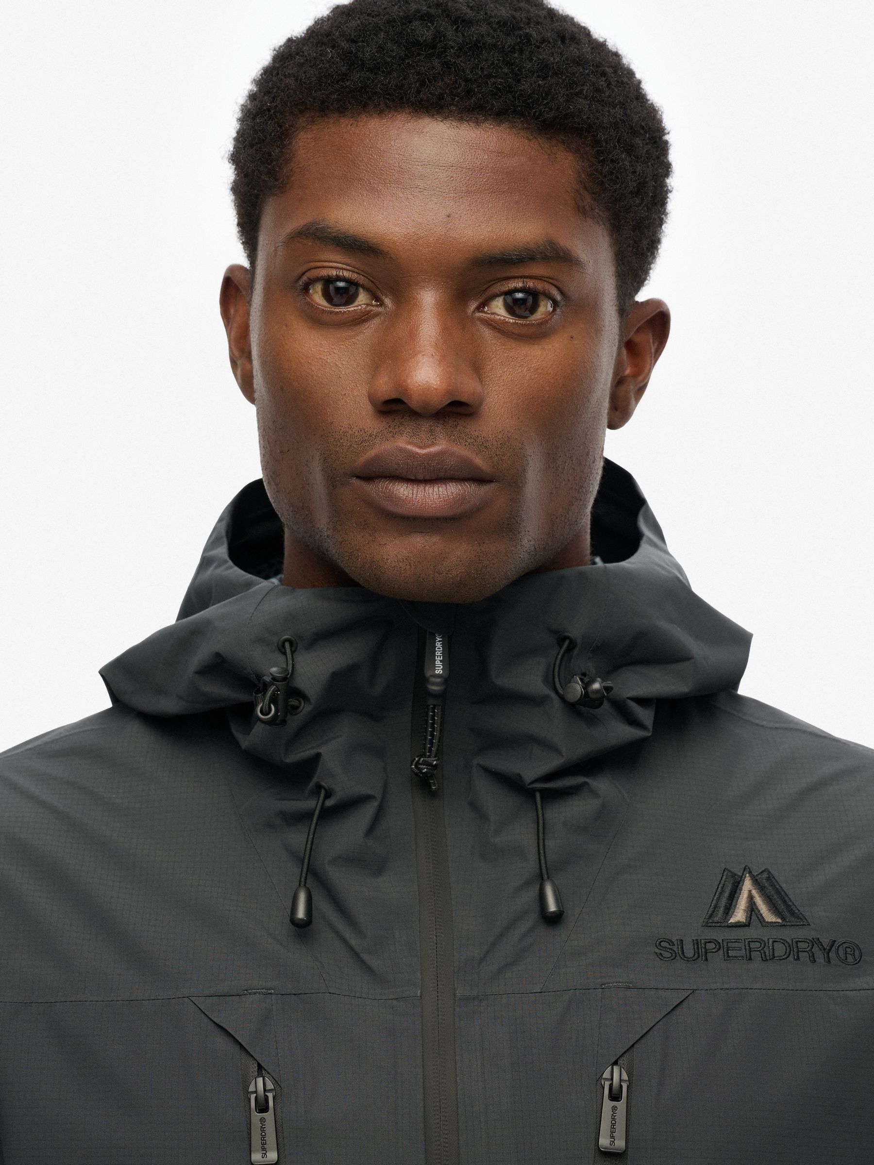 SuperDry Sport フード付きナイロンジャケット Buy Superdry Blue Grey Graphite Waterproof Hooded Logo Jacket from