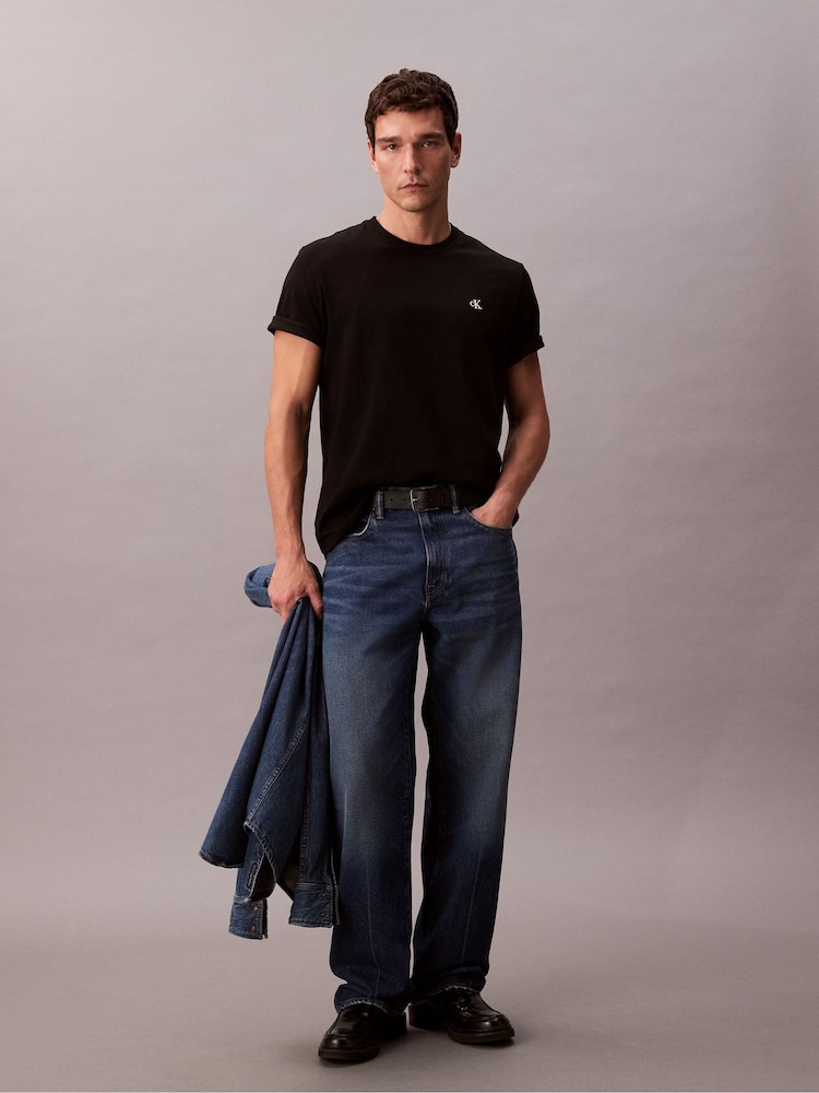 Calvin Klein Black Embroidered Monogram Logo Relaxed T-Shirt - Image 1 of 6 Calvin Klein Black Embroidered Monogram Logo Relaxed T-Shirt - Image 1 of 6