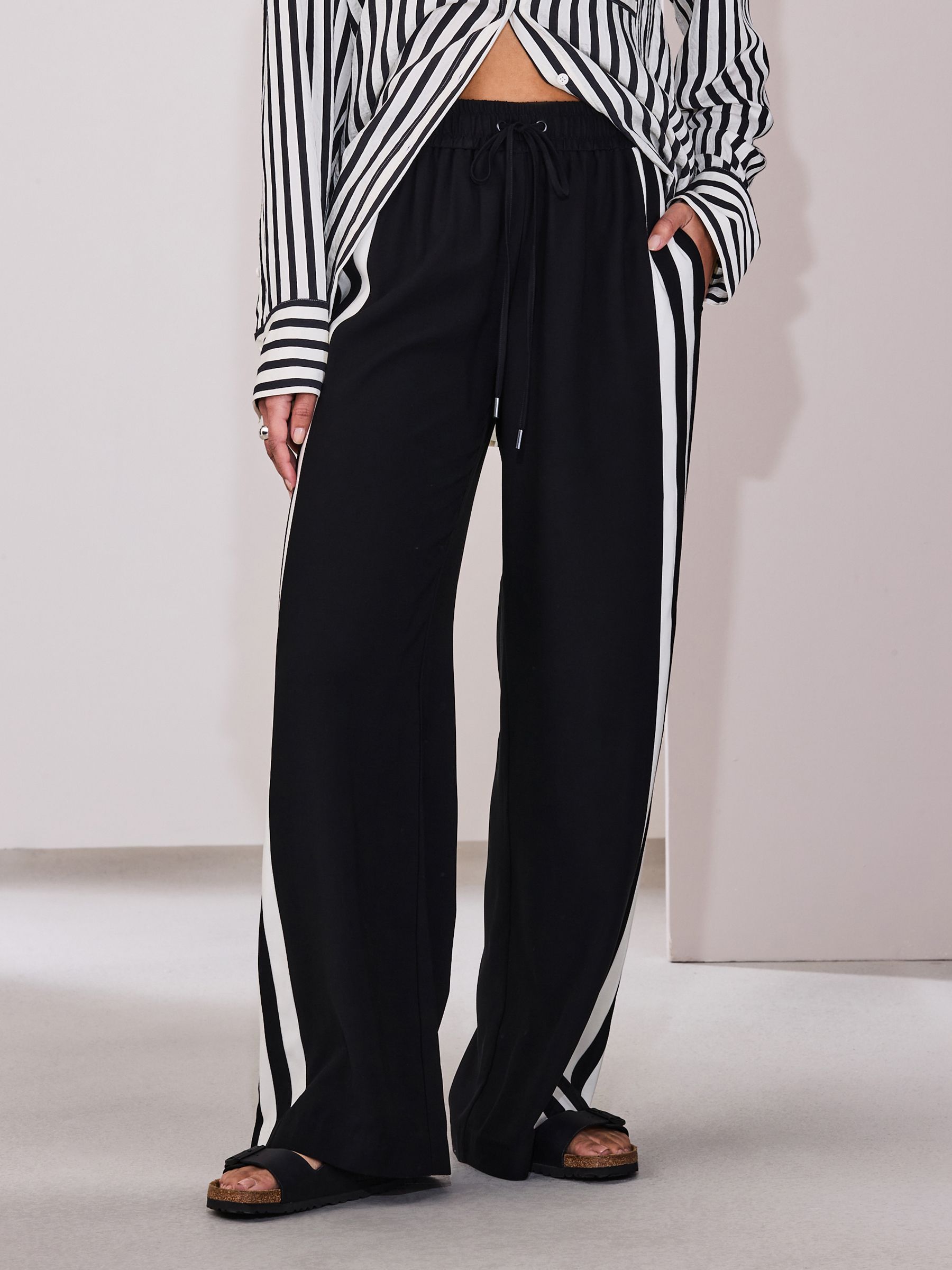Buy Black Wide Leg Side Stripe Trousers from Next Canada