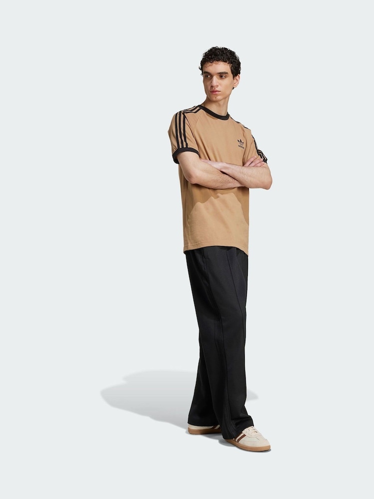 adidas Originals Black Adicolor Baggy Fit Firebird Track Joggers - Image 1 of 5 adidas Originals Black Adicolor Baggy Fit Firebird Track Joggers - Image 1 of 5