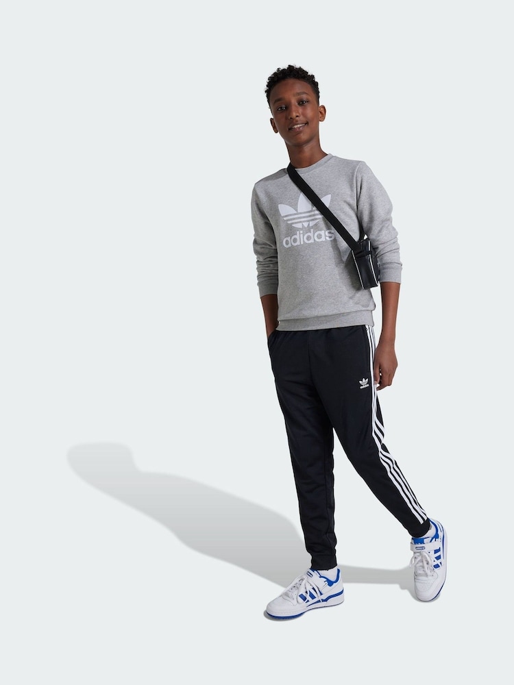 adidas Originals Black Adicolor SST Track Tracksuit Joggers - Image 1 of 4 adidas Originals Black Adicolor SST Track Tracksuit Joggers - Image 1 of 4