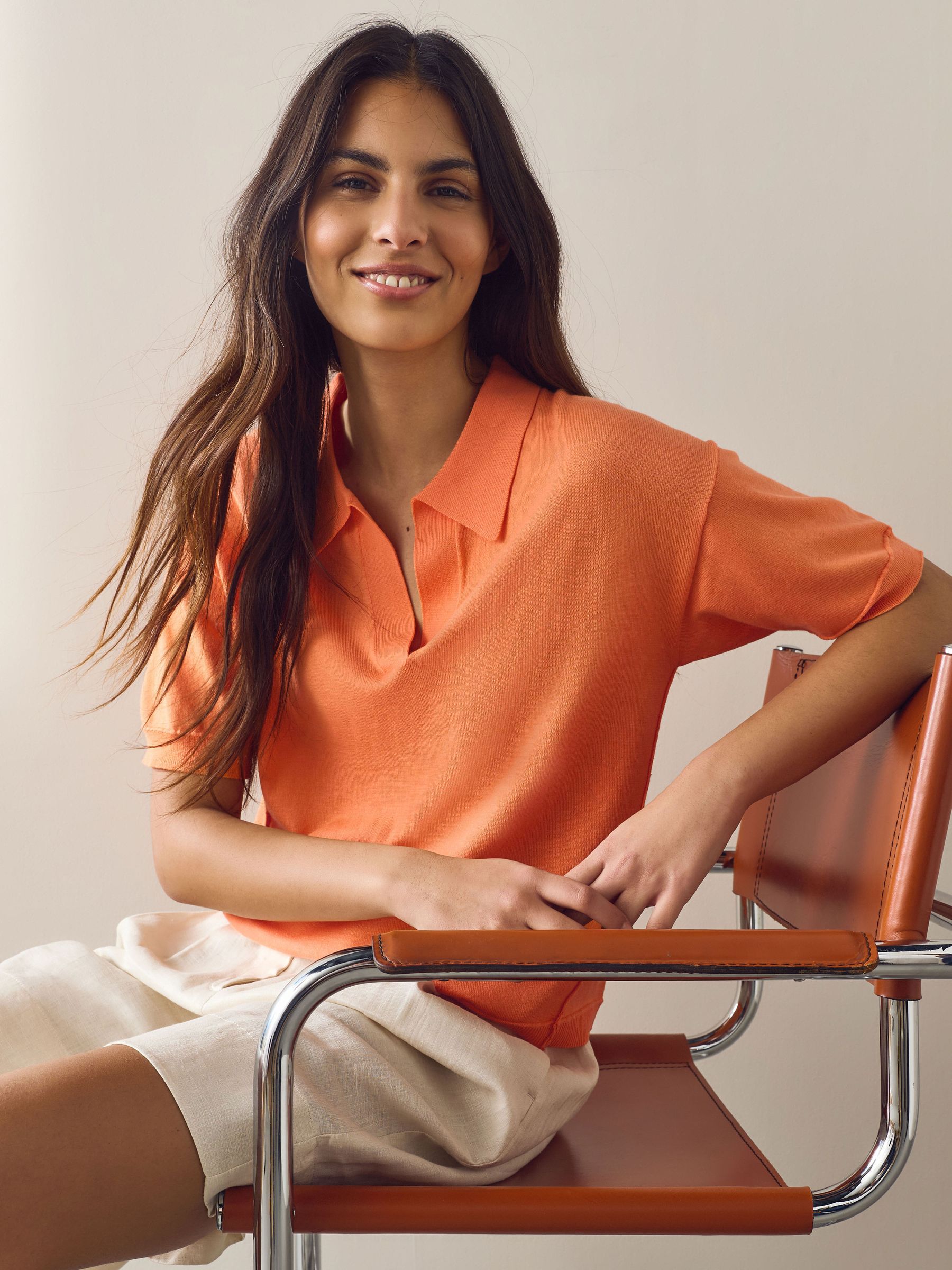 Buy Orange Cotton Rich Soft Touch Knitted Polo Top from the Next