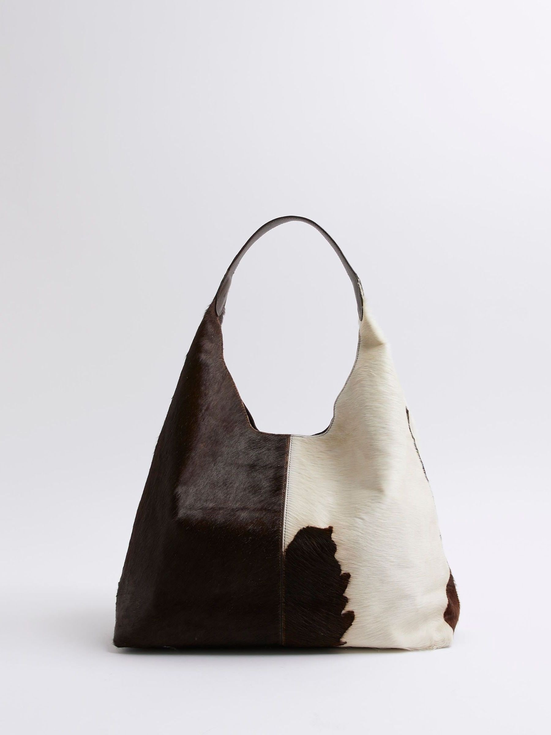 Buy River Island Brown Cow Print Oversized Slouch Bag from the
