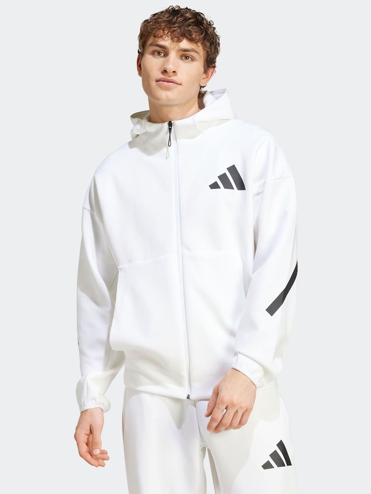 تشكيلة Z.N.E من adidas سترة رياضية بهودي وسحاب كامل - صورة 1 من 8