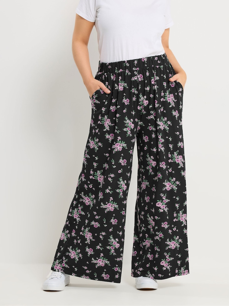 Yours Curve Black Floral Jersey Wide Leg Trousers - Image 1 of 6