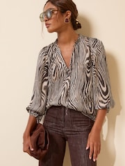 Friends Like These Zebra Print Long Sleeve Chiffon Tie Neck Blouse - Image 1 of 5