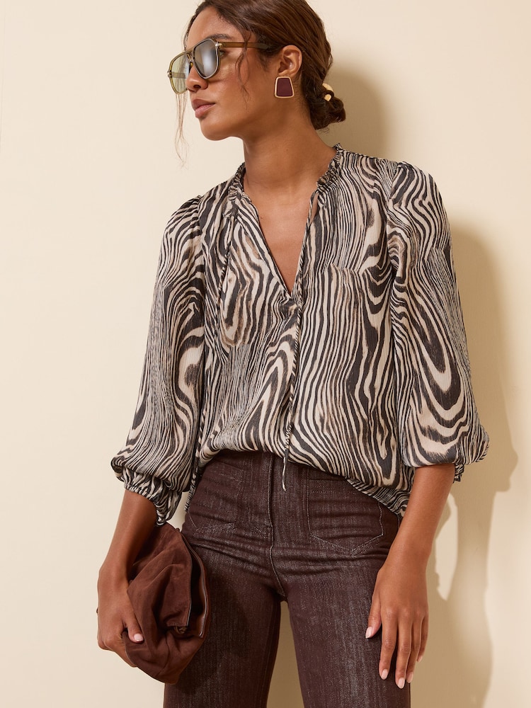 Friends Like These Zebra Print Long Sleeve Chiffon Tie Neck Blouse - Image 1 of 5
