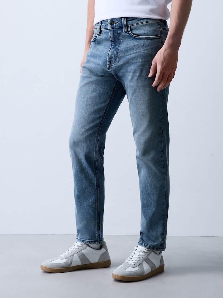 Light Blue Slim Fit Motion Flex Jeans - Image 1 of 7 Light Blue Slim Fit Motion Flex Jeans - Image 1 of 7
