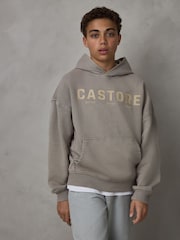 صخري - هودي ثقيل الوزن من القطن بشعار كبير الحجم من Castore - صورة 1 من 7