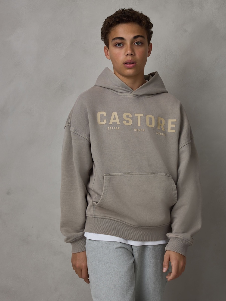 صخري - هودي ثقيل الوزن من القطن بشعار كبير الحجم من Castore - صورة 1 من 7