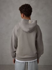 صخري - هودي ثقيل الوزن من القطن بشعار كبير الحجم من Castore - صورة 2 من 7