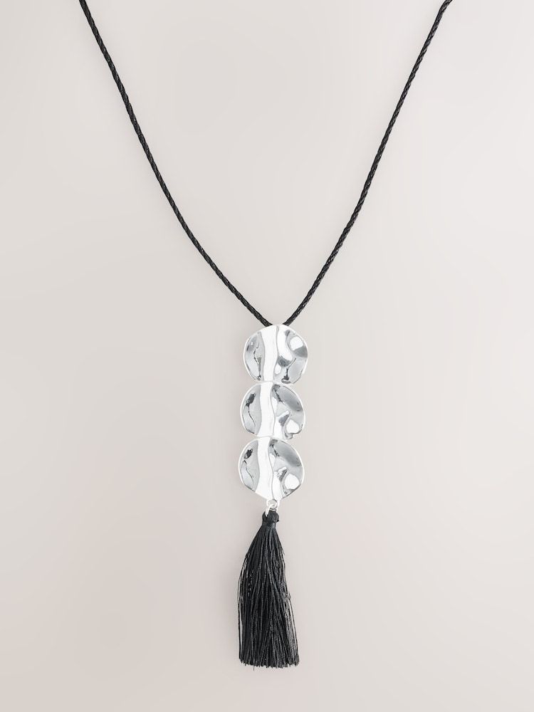 Silver Tone/Black Disc Pendant Tassel Cord Long Necklace - Image 1 of 3 Silver Tone/Black Disc Pendant Tassel Cord Long Necklace - Image 1 of 3